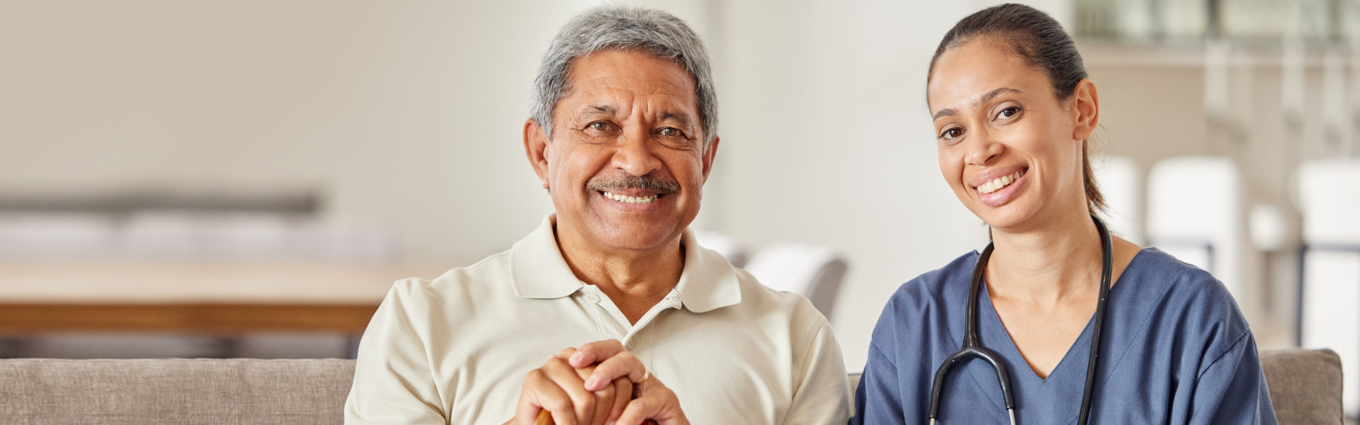 nurse and elderly looking at the camera